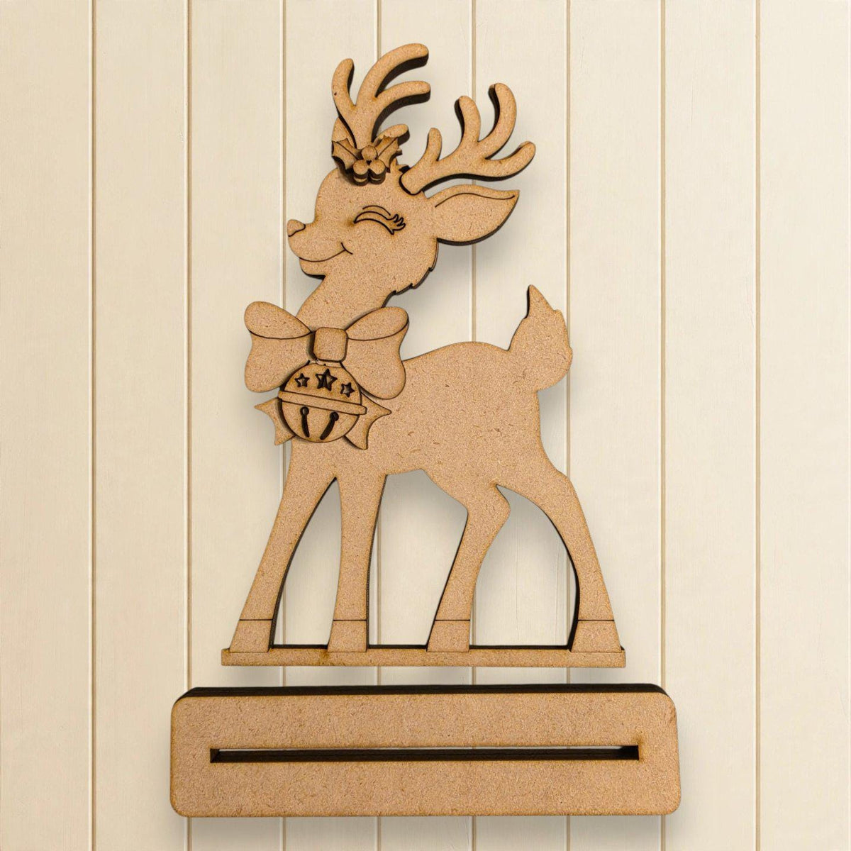 A wooden deer figure with antlers and a bow tie is displayed against a white background.