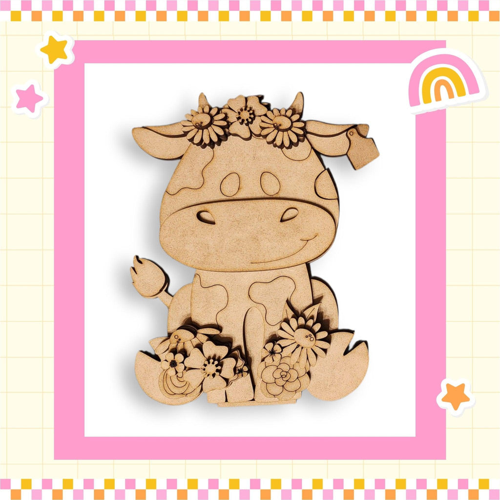 a wooden cutout of a cow with flowers
