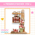 The image is a collage featuring a wooden sign with the phrase "Home Sweet Home" and various decorative elements such as candy canes, a star, and a heart.