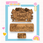 two wooden magnets with the words america and a rainbow in the background