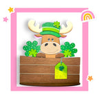 a st patrick's day card with a cow in a wooden box