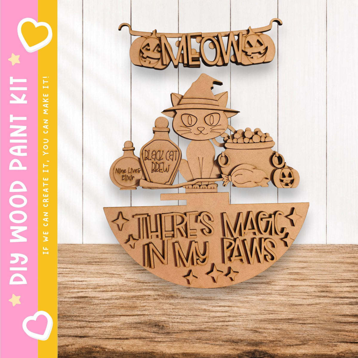 The image is a wooden craft kit featuring a cat wearing a witch's hat and surrounded by Halloween-themed items such as a jack-o-lantern, a witch's broom, and a cauldron.