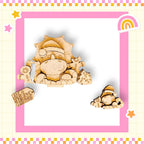 a wooden cutout of a dinosaur wearing a Santa hat, surrounded by other wooden cutouts and a pink and white checkered border.