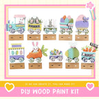The image is a collage of nine Easter-themed wooden train car decorations, each featuring a different Easter egg and bunny design. The decorations are displayed on wooden platforms, and the image includes text that reads "DIY WOOD PAINT KIT" and "IF WE CAN CREATE IT, YOU CAN MAKE IT!"