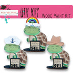 three turtle figurines with hats on each of them