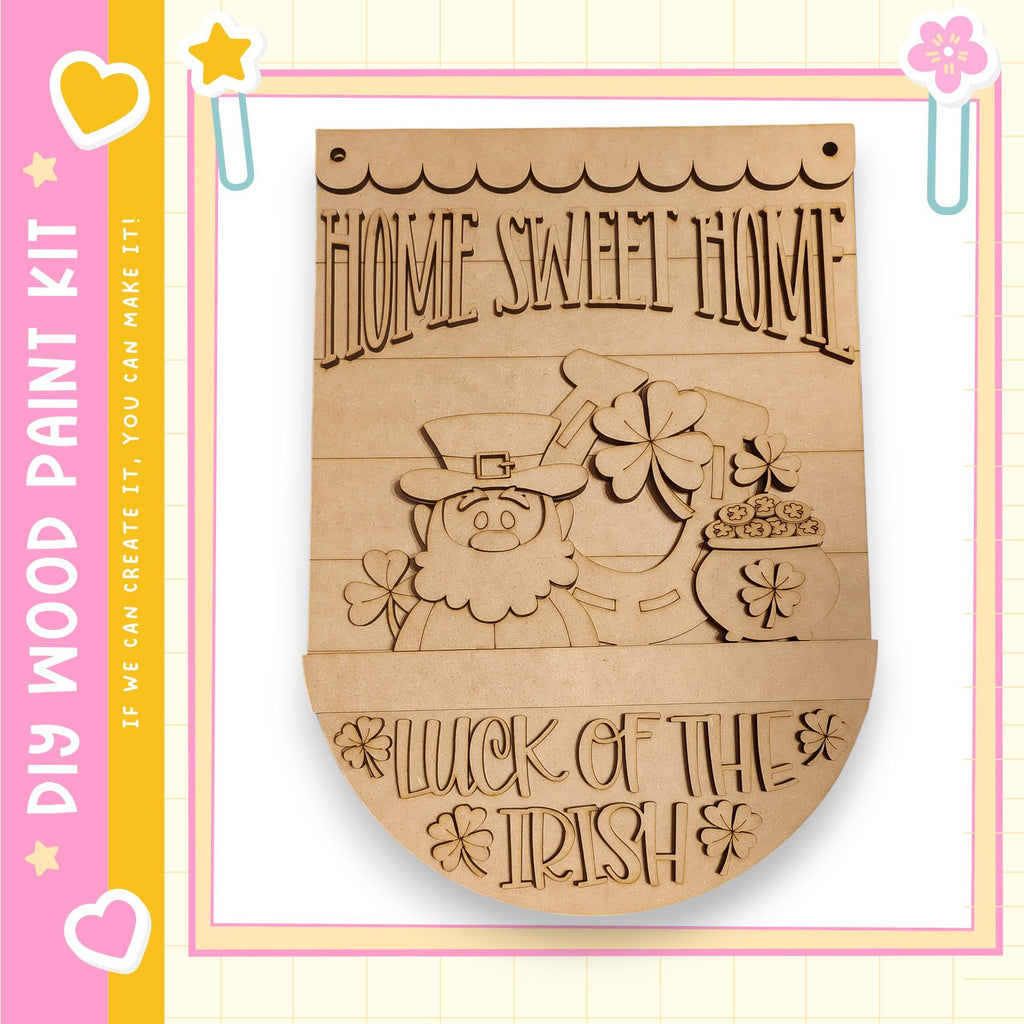 a wooden sign with the text "Home Sweet Home" and a depiction of a leprechaun holding a pot of gold coins.