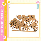 a wooden paint kit with a pink and yellow border, containing a group of wooden flowers or figures.