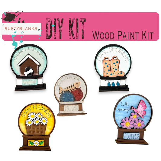 a collection of wooden paint kits for crafts