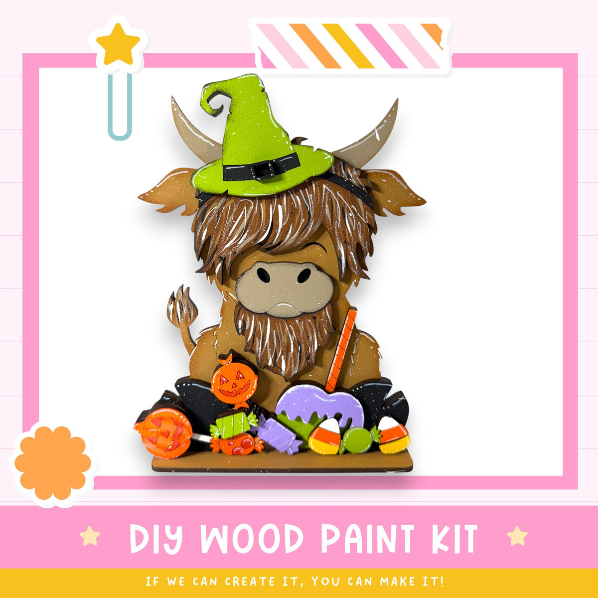 A wooden paint kit featuring a cartoon cow wearing a witch's hat, surrounded by Halloween-themed decorations such as candy and pumpkins.