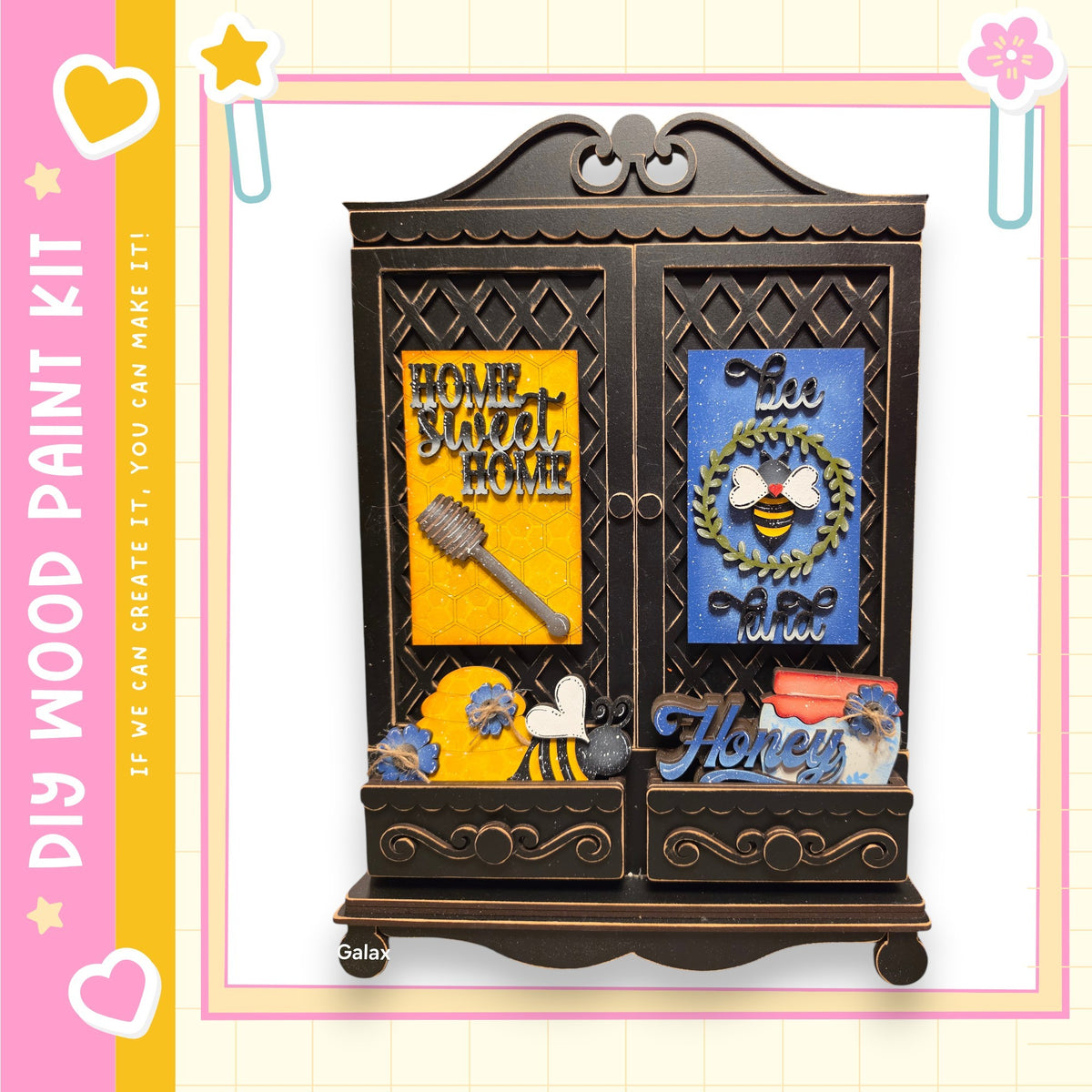 The image is a wooden paint kit featuring a decorative cabinet with various items and text.