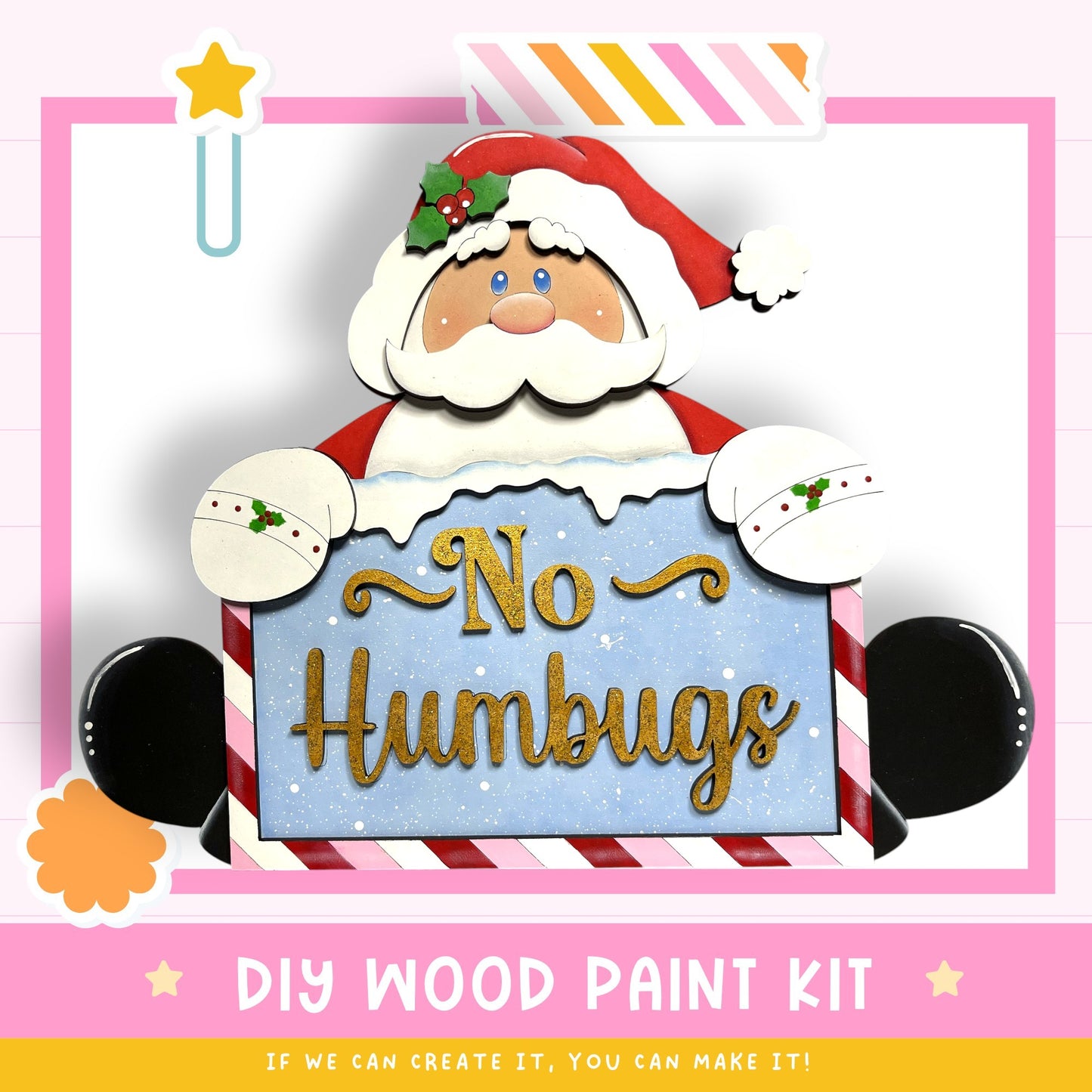 a DIY wood paint kit for creating a "No Humbs" sign, with a Santa Claus figure holding the sign.