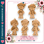 a collection of wooden teddy bear ornaments, each with a unique design and color, arranged in a visually appealing manner. The text "Creativity Begins with One Brushstroke" suggests that these ornaments can be created using a single brushstroke technique, which is a creative approach to crafting these decorative items. The image is described as a "Handmade by You" and is part of a series of handmade items, possibly for the holiday season.