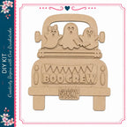 A wooden truck with three ghostly figures on the back, and the word "BOOGREW" written on the side.