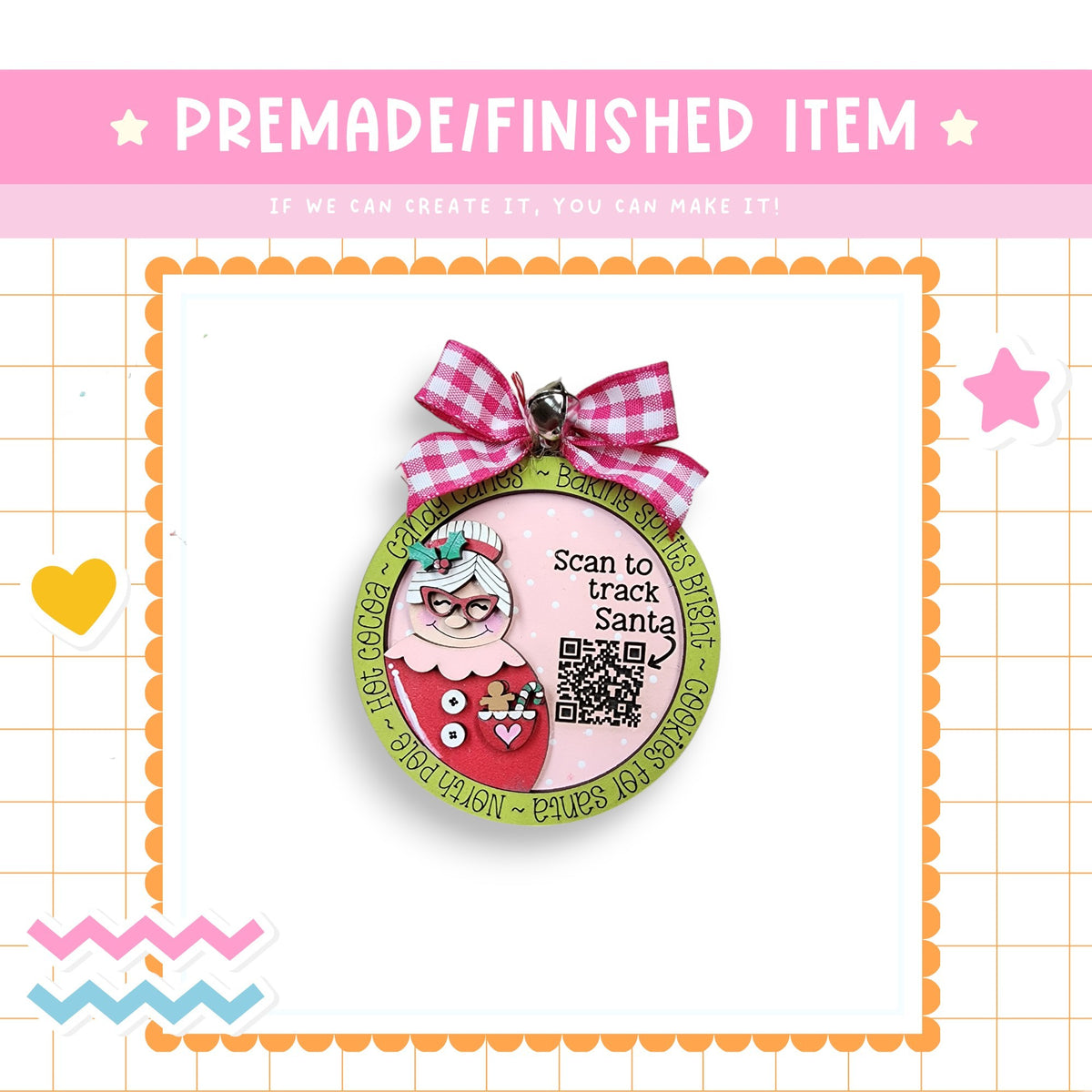 a christmas ornament with a pink bow on it