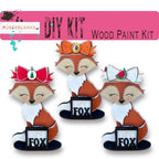 a group of three fox figurines sitting next to each other