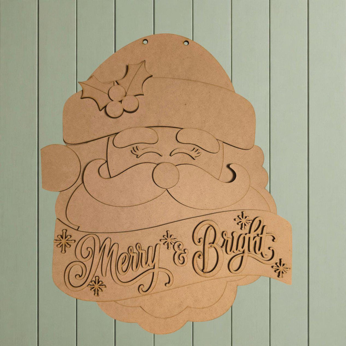 A wooden cutout of Santa Claus with the text "Merry & Bright" below it.