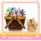 a DIY wood paint kit for creating wooden baskets or planters. The kit includes instructions and materials for creating a wooden basket or planter, with a focus on butterflies and flowers.