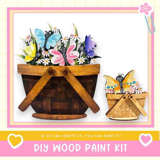 a DIY wood paint kit for creating wooden baskets or planters. The kit includes instructions and materials for creating a wooden basket or planter, with a focus on butterflies and flowers.