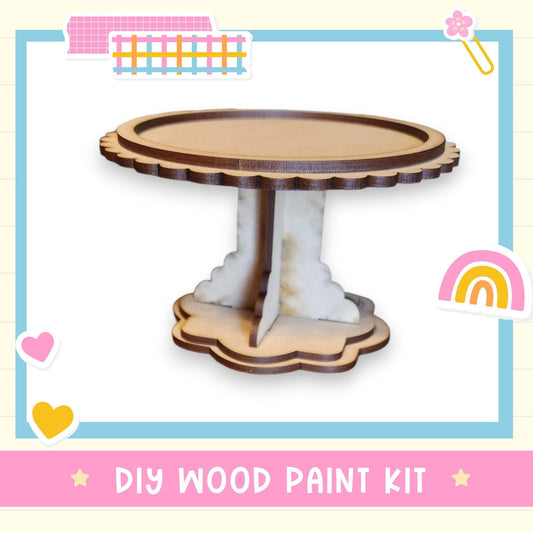 a DIY wood paint kit, with a wooden cake stand and a heart-shaped base.