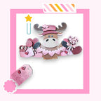 a picture of a cow wearing a pink hat