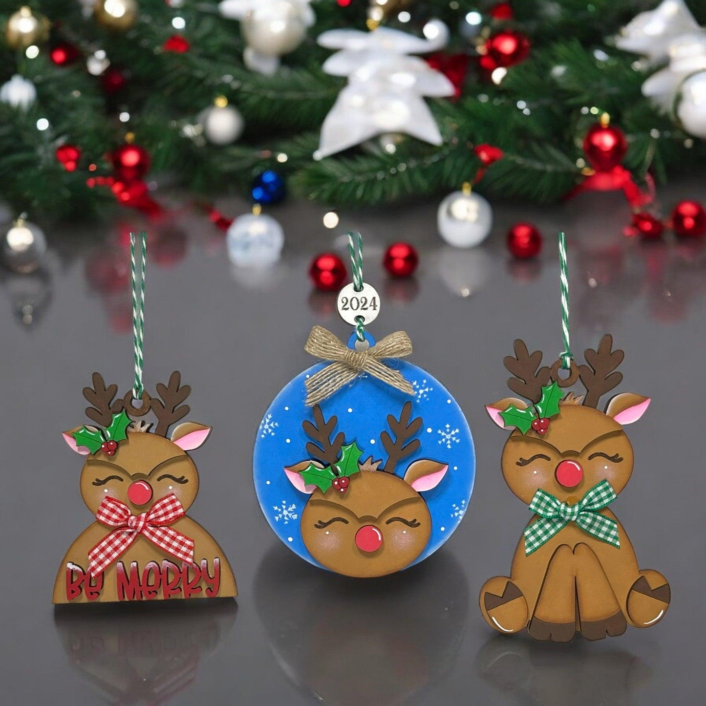 a couple of christmas ornaments sitting on top of a table