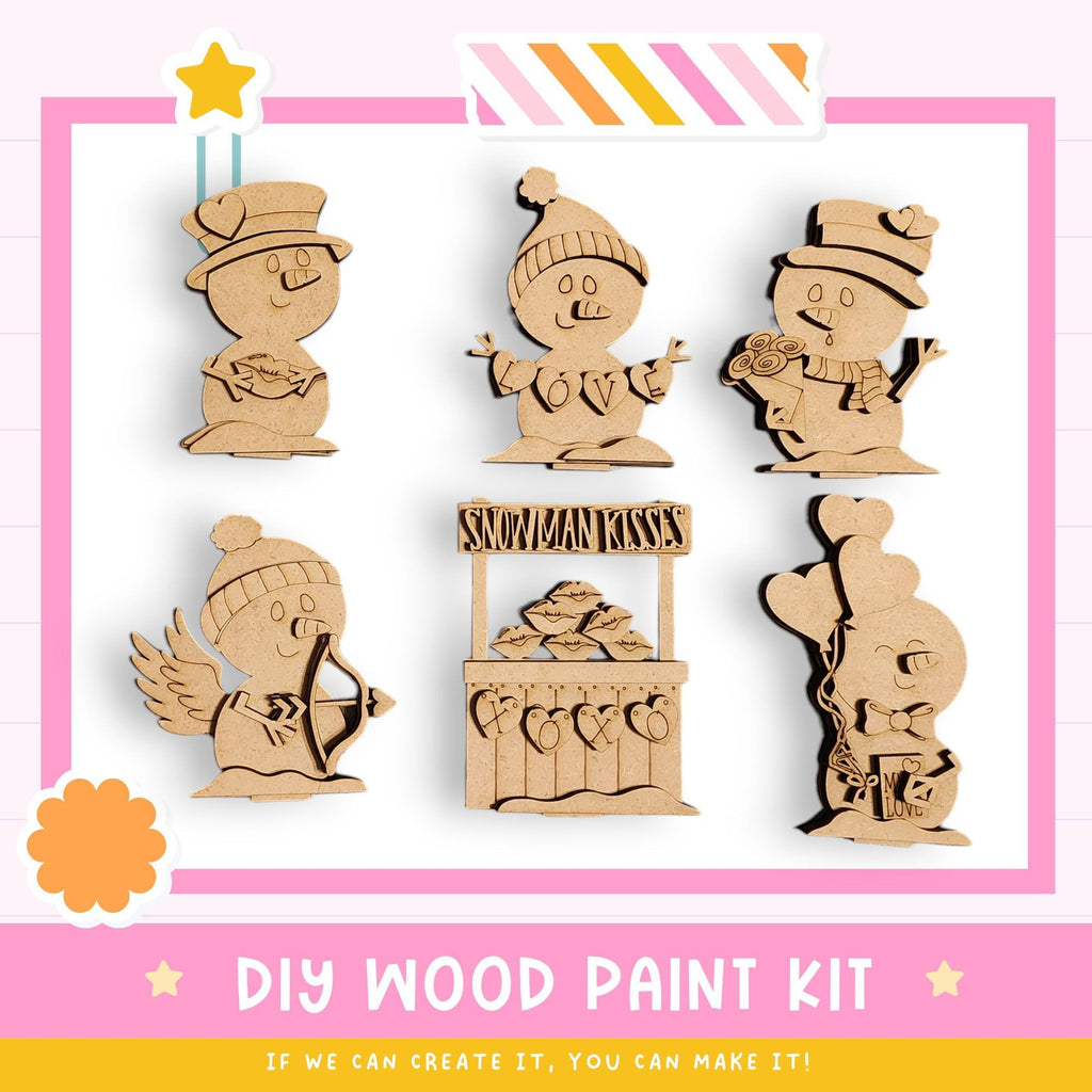 The image is a DIY wood paint kit featuring six wooden snowman or snow angel figures, each with unique designs and accessories. The kit appears to be made of wood and is designed for painting.