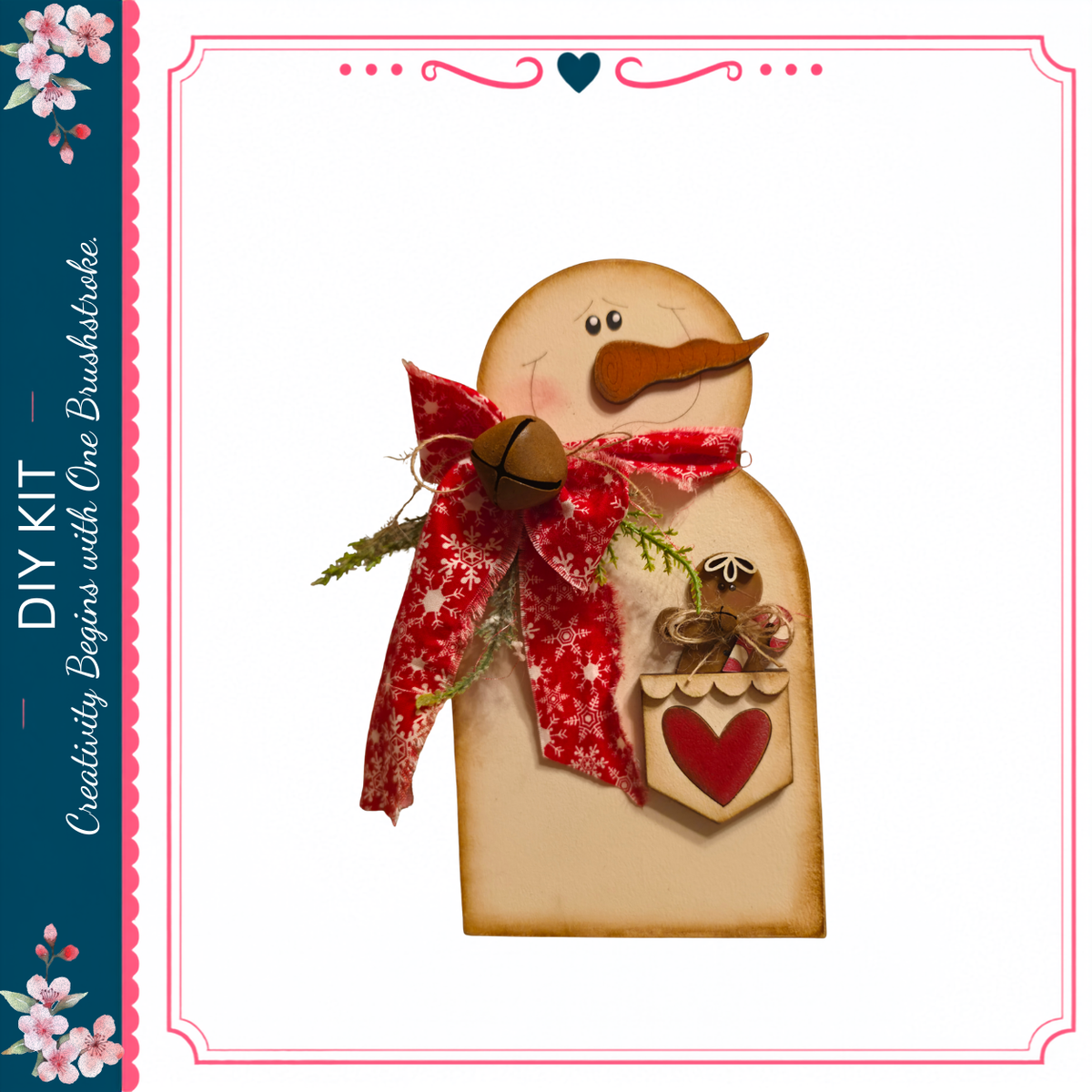 A wooden snowman figure with a red scarf and a heart-shaped ornament, set against a white background.