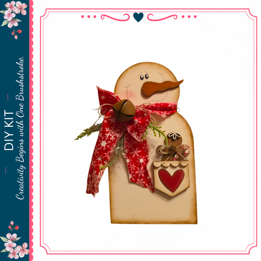 A wooden snowman figure with a red scarf and a heart-shaped ornament, set against a white background.