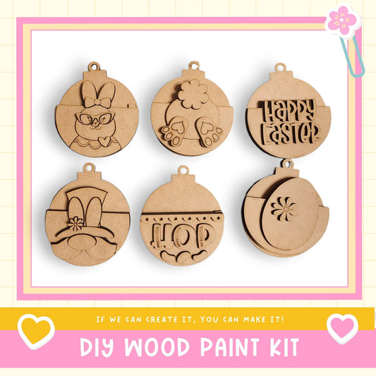 a DIY wood paint kit with six wooden ornaments, each with a unique design, displayed on a white background.