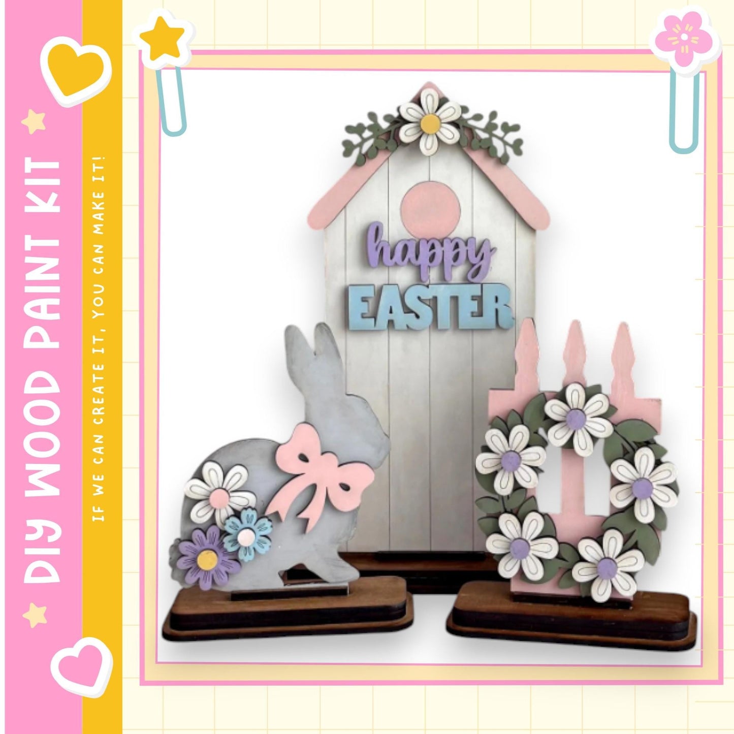 a wooden Easter-themed display with a bunny, a wreath, and a sign that says "happy easter". The bunny is decorated with flowers and a bow, and the wreath is adorned with purple and white flowers. The sign reads "happy easter". The display is set against a pink and yellow background, and there are additional decorative elements such as hearts and stars.