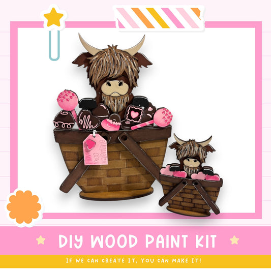 a DIY wood paint kit with a wooden basket containing a large wooden toy with horns and a smaller wooden toy. The kit appears to be made of wood and is designed for creating wooden toys.