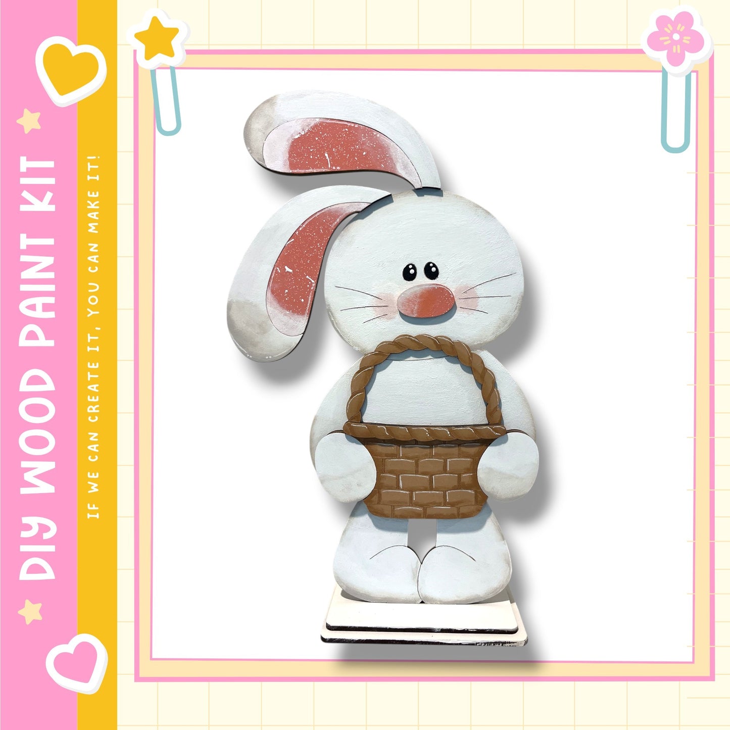 A wooden toy rabbit holding a basket, set against a pink and yellow background with decorative elements.