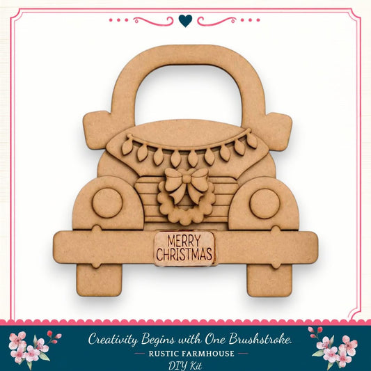 A wooden Christmas-themed car decoration with a wreath and the text "MERRY CHRISTMAS" on the front.