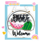 a welcome sign with a watermelon and a rainbow in the background
