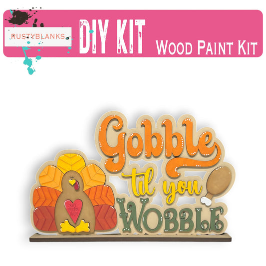 a wooden sign that says gobble til you wobble