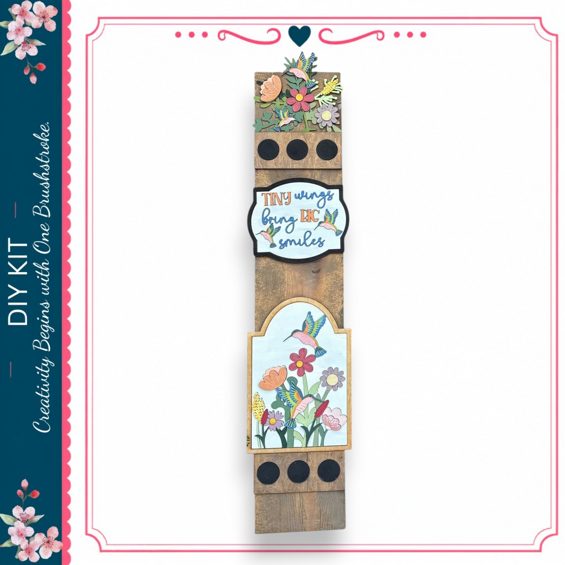 a wooden sign with a floral design and a motivational quote.