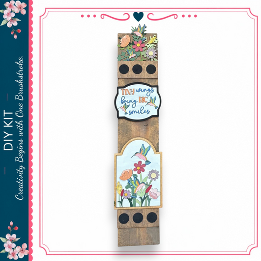 a wooden sign with a floral design and a motivational quote.