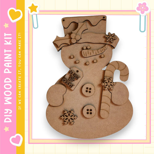 A wooden snowman kit with various decorations and accessories, including a carrot, buttons, and a hat.