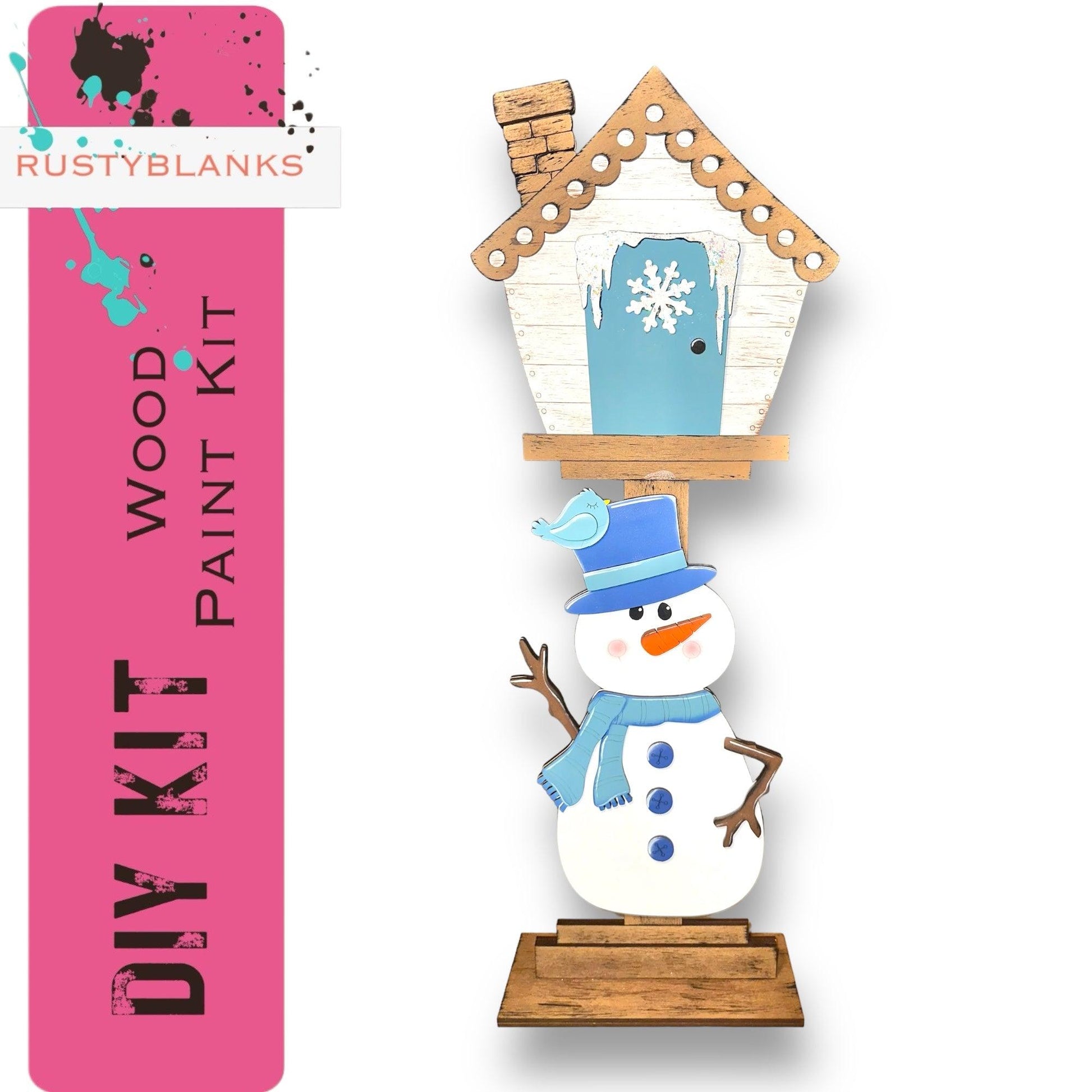 a wooden snowman with a birdhouse on top of it