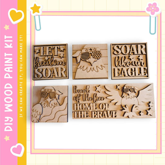 a collection of wooden cutouts, each featuring an eagle and the text "Let freedom soar" or "Soar like an eagle". The cutouts are arranged in a row, and the background is a pink and yellow color scheme with decorative elements such as hearts and stars.