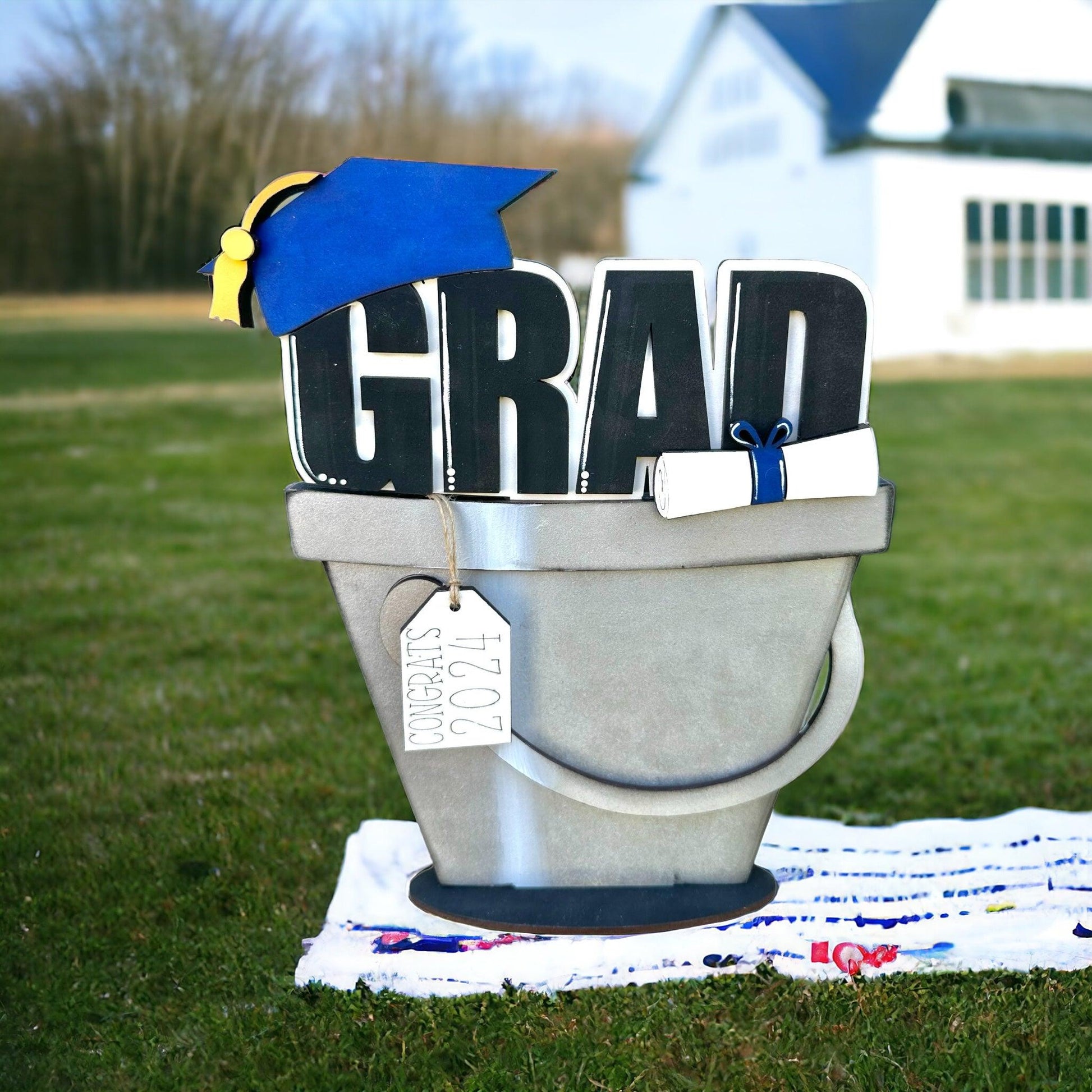 a graduation cap sits on top of a parking meter