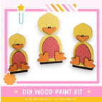 a picture of three wooden ducks with a pink background