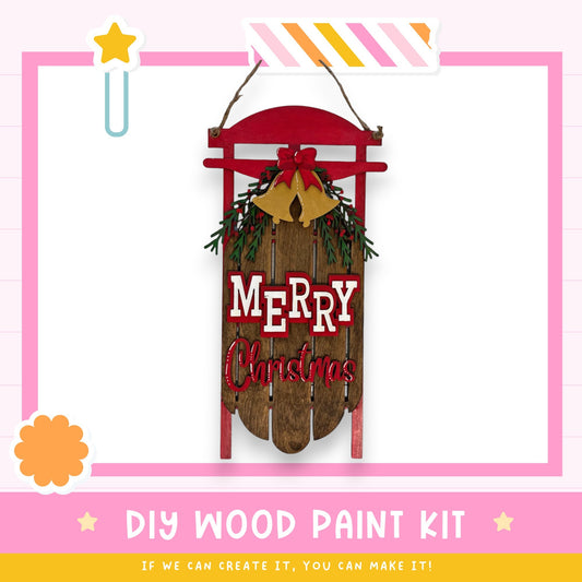 a wooden sign that says merry christmas hanging on a wall