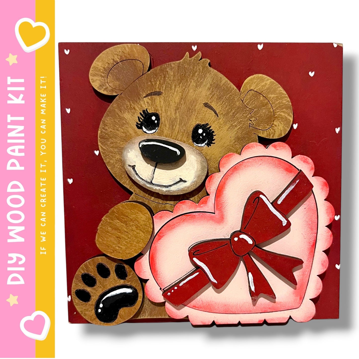 A wooden teddy bear holding a heart-shaped object with a red ribbon, set against a red background with white hearts scattered throughout.