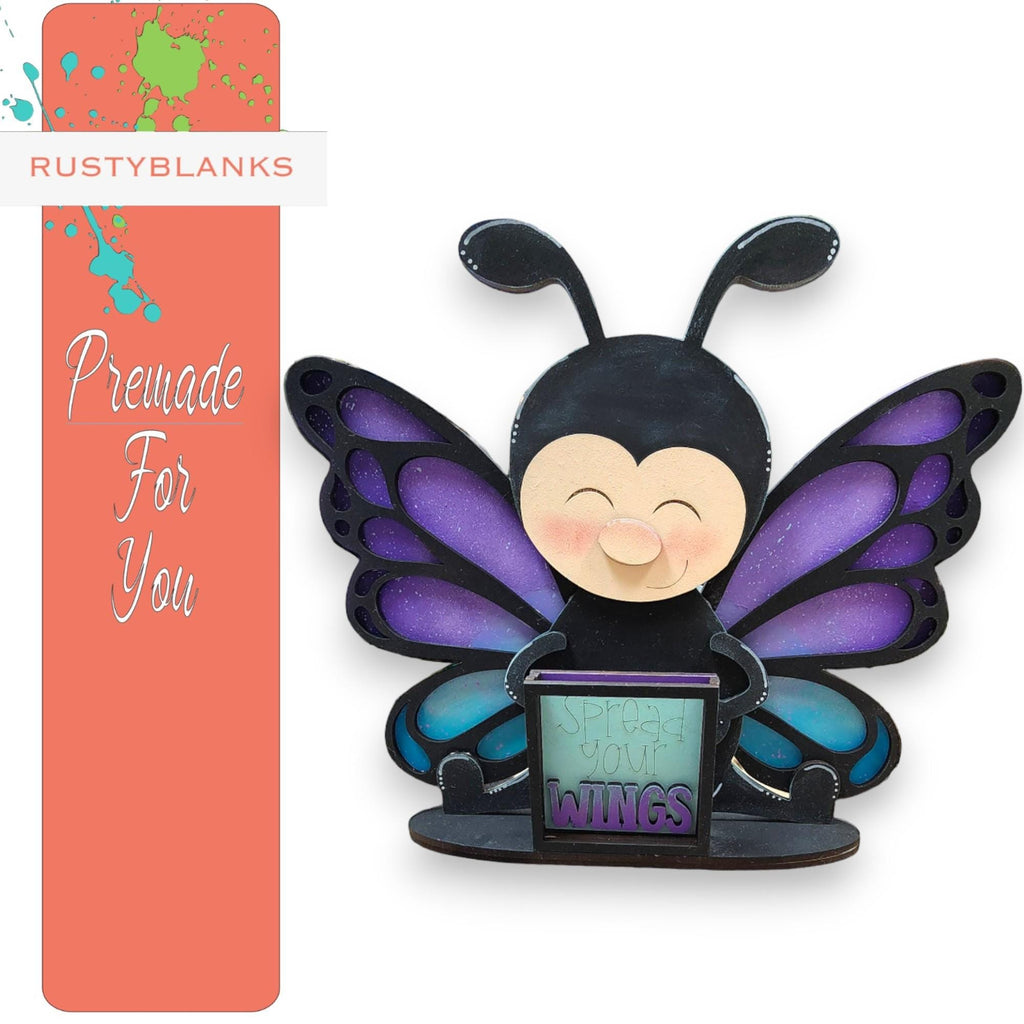 a picture of a purple and black butterfly with wings