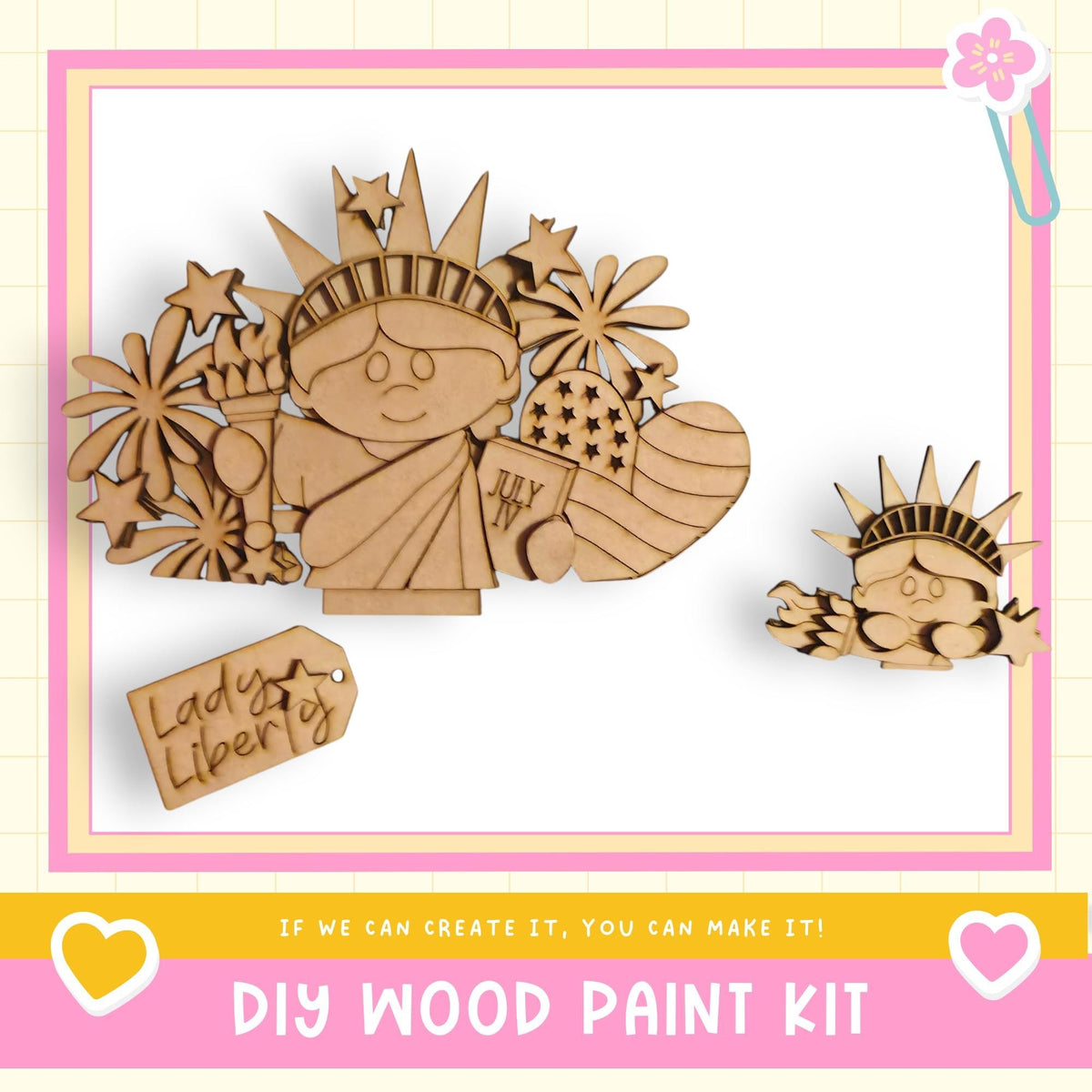 The image is a DIY wood paint kit featuring a wooden figure of the Statue of Liberty surrounded by various wooden shapes and decorations.