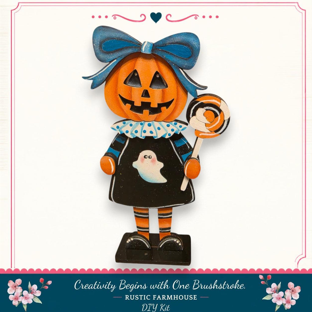 A Halloween-themed pumpkin figurine with a bow, holding a lollipop, and wearing a black dress with a ghost design.
