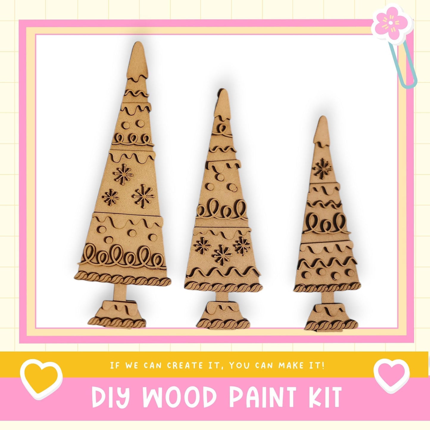 three wooden Christmas trees with intricate designs, displayed in a frame.