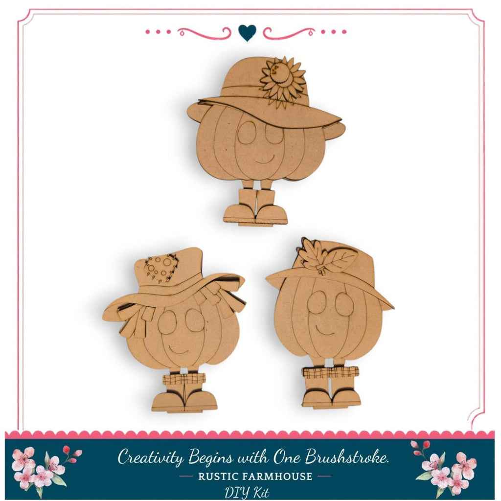 three wooden pumpkin cutouts with hats and flower decorations, arranged in a row.