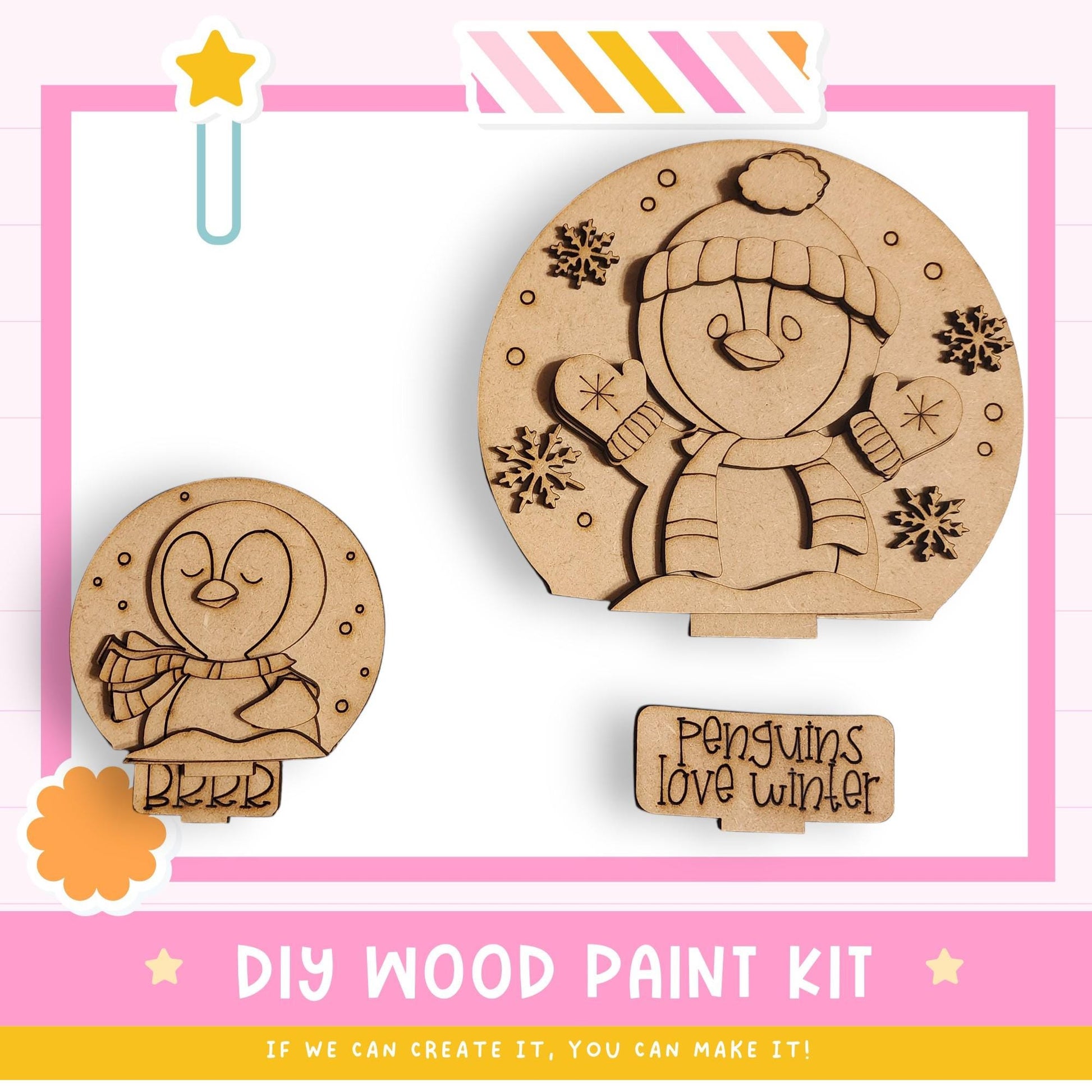 a DIY wood paint kit for creating wooden snowmen and penguins. The kit includes two wooden snowman and penguin shapes, along with a label that says "Penguins Love Winter".